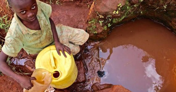 Picture of boy gathering water