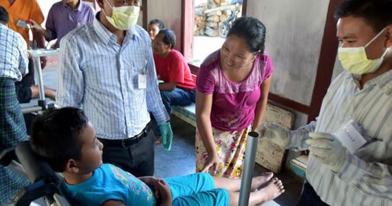 Picture of mother comforting her child before receiving dental care