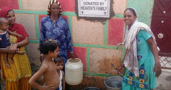 villagers in india drinking pure water