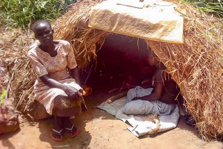 Picture of widow in makeshift hut in Uganda