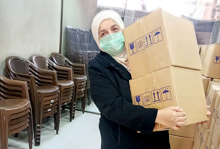 Picture of Bahije receiving supplies