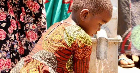 Picture of girl drinking clean water from well in Malawi