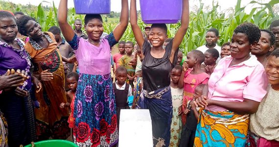 Image of villagers in Malawi with safe water