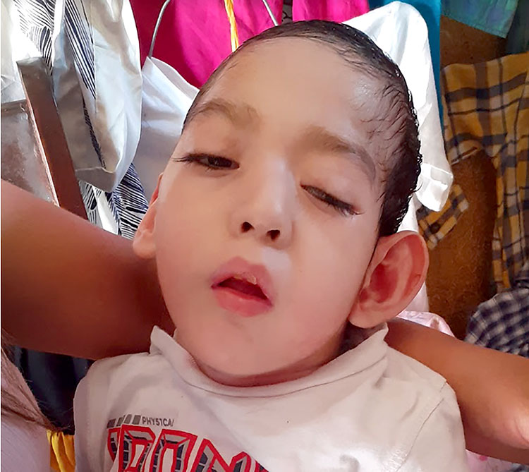 Picture of a six year old javier in his mother's arms