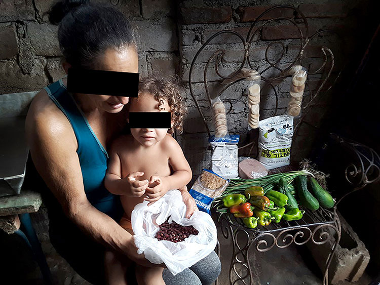 Image of family receiving beans