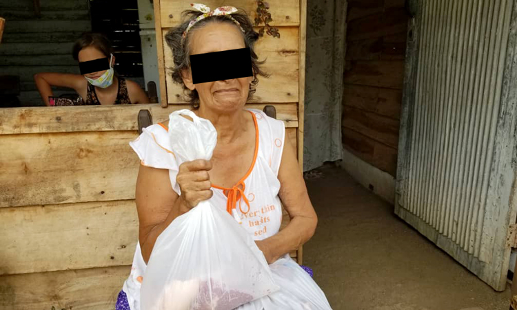Image of woman receiving aid