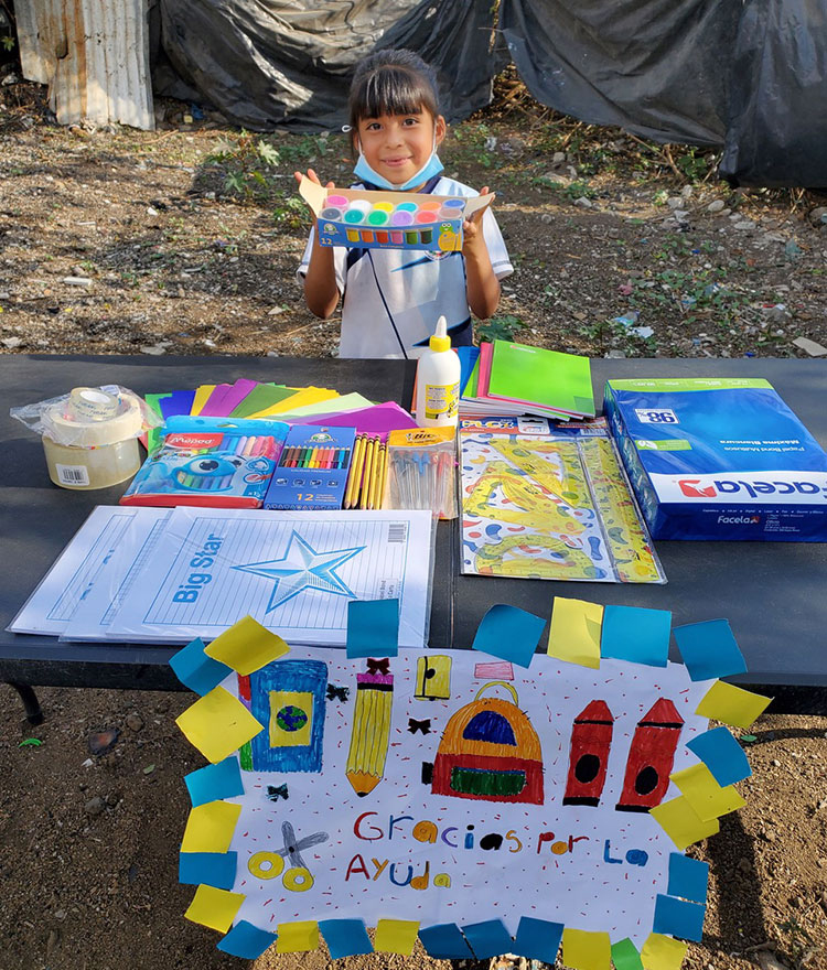 Image of Ceci with school supplies