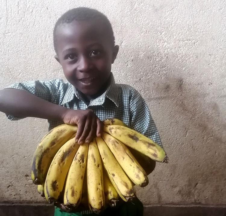 Image of James holding bananas
