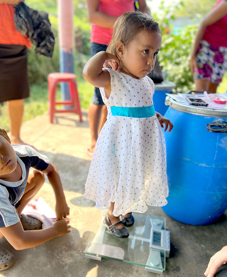 Image of children in Guatemala being weighed