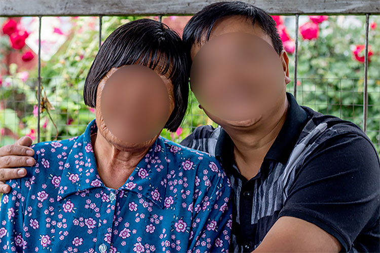 Picture of missionary with victim of leprosy