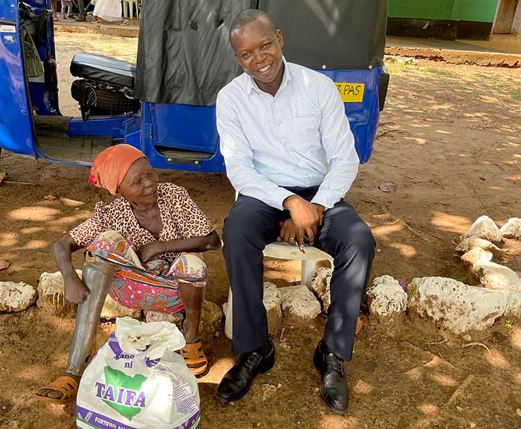 Image of victim of leprosy receiving aid