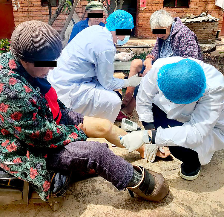 Image of victims of leprosy receiving wound care