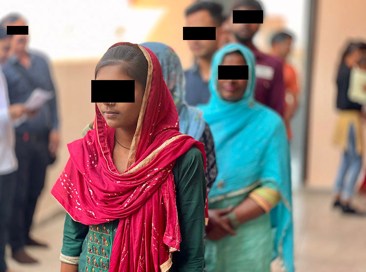 Image of new believers in India in line to be baptized