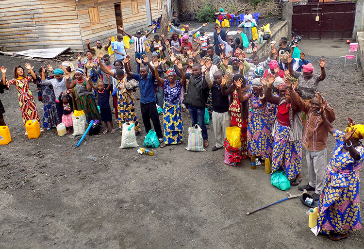 Refugees in DR Congo lifting hands