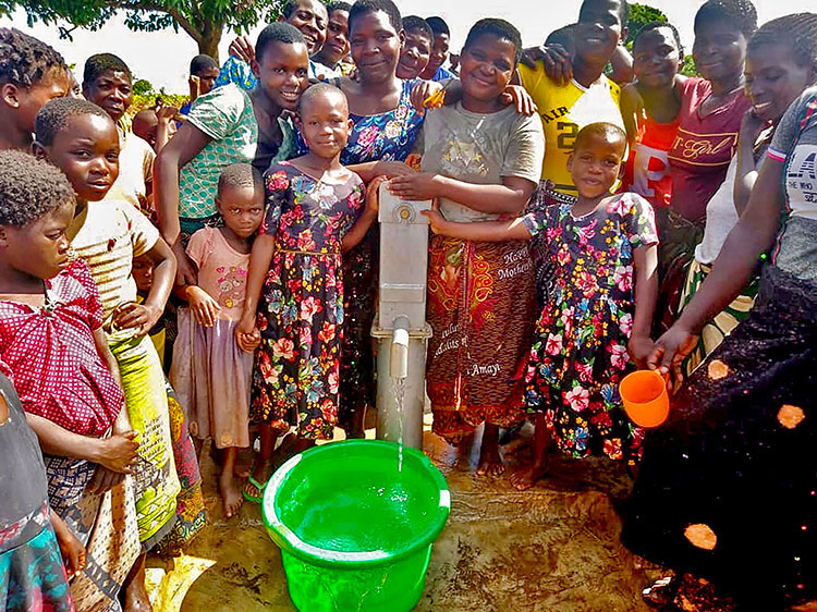 Image of villagers in Malawi with safe water
