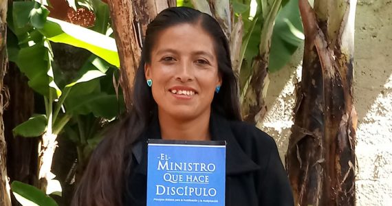 Paz Islas Rufino from Mexico with Disciple-Making Minister book