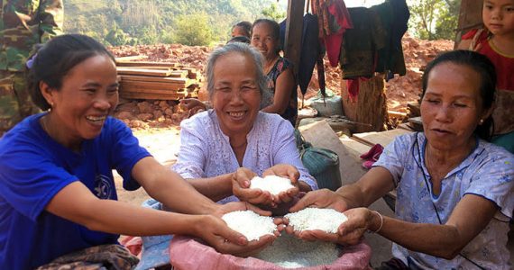 Women in Laos with rice bags