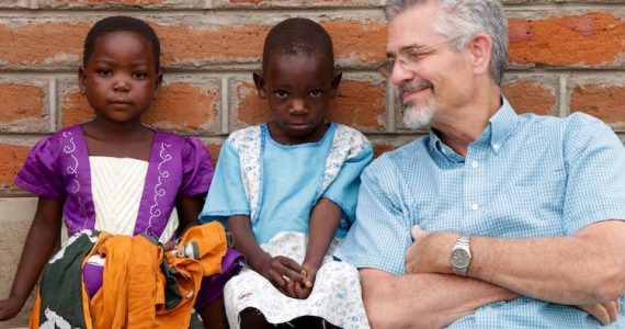 Picture of David with children in Malawi