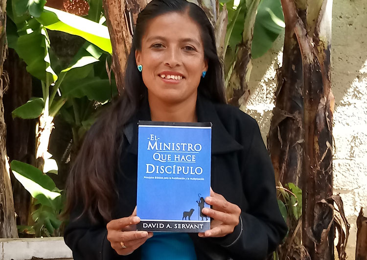 Paz Islas Rufino from Mexico with Disciple-Making Minister book