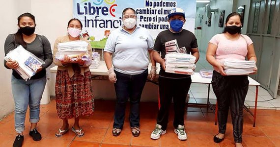 Picture of parents in Guatemala receiving educational packets