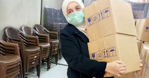Picture of Bahije receiving supplies