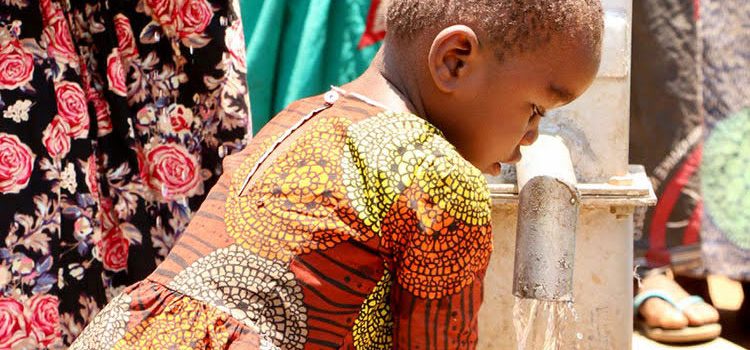 Picture of girl drinking clean water from well in Malawi