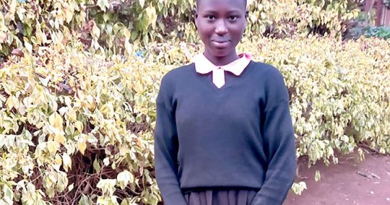 Image of student in Kenya with uniform