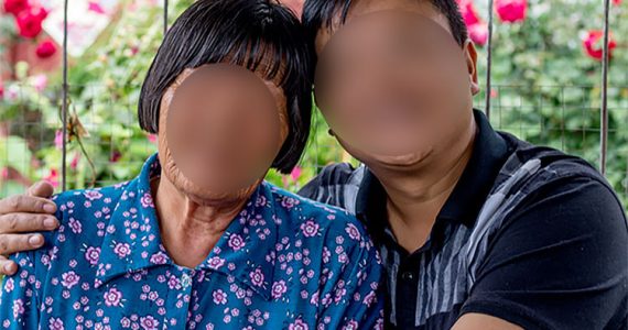 Image of missionary with victim of leprosy