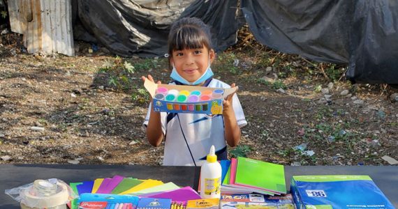 Image of Ceci with school supplies