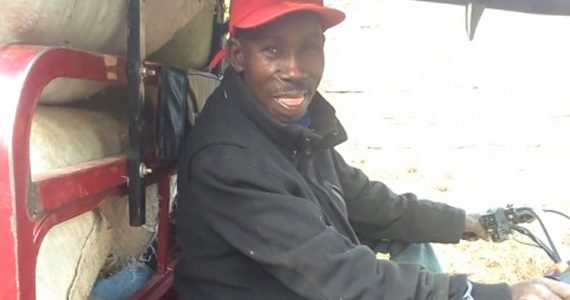 Image of Microloan borrower with Tuk-Tuk